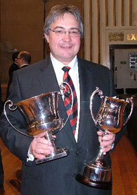 Dr Robert Childs holds the trophy