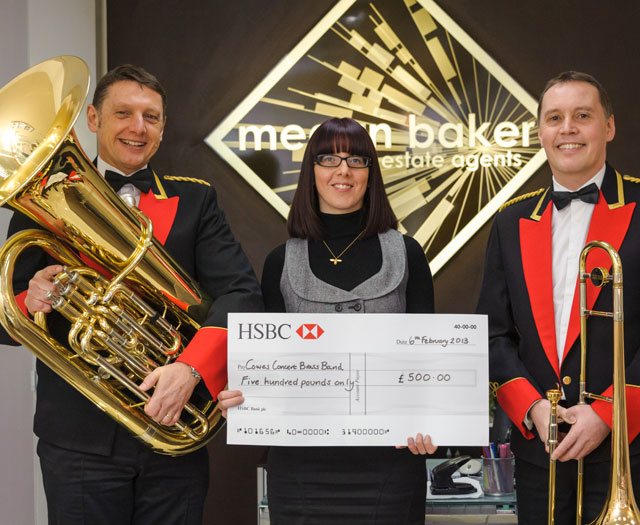 Cowes Concert Brass with cheque Cowes Concert Brass with cheque